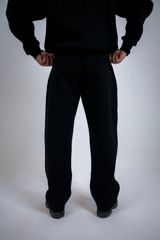 Person wearing a black suitcase on a white background