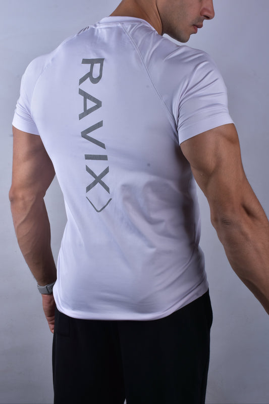 Man wearing a white t-shirt with 'RAVIX' logo on the back against a gray background