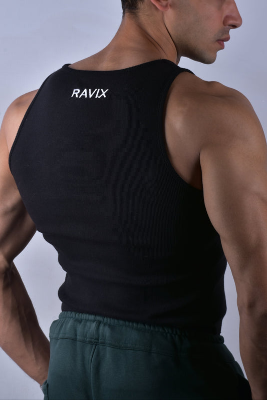 Man wearing a black tank top with 'RAVIX' branding on the back against a plain background