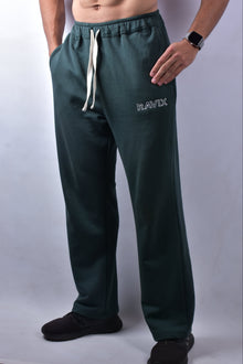 Green pants with 'RAVIX' branding on a white background